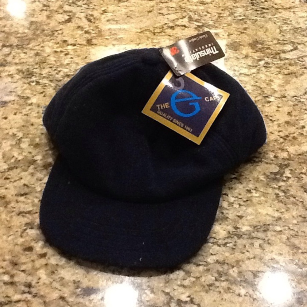 The G Cap A cap with a bill and ear flaps size XL